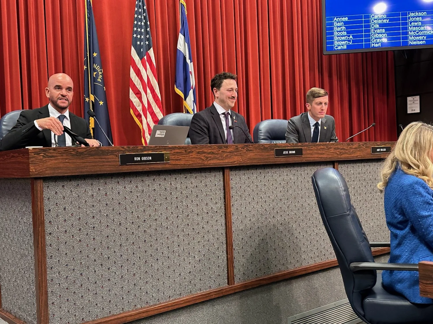 Jesse delivering remarks from the council chamber dais